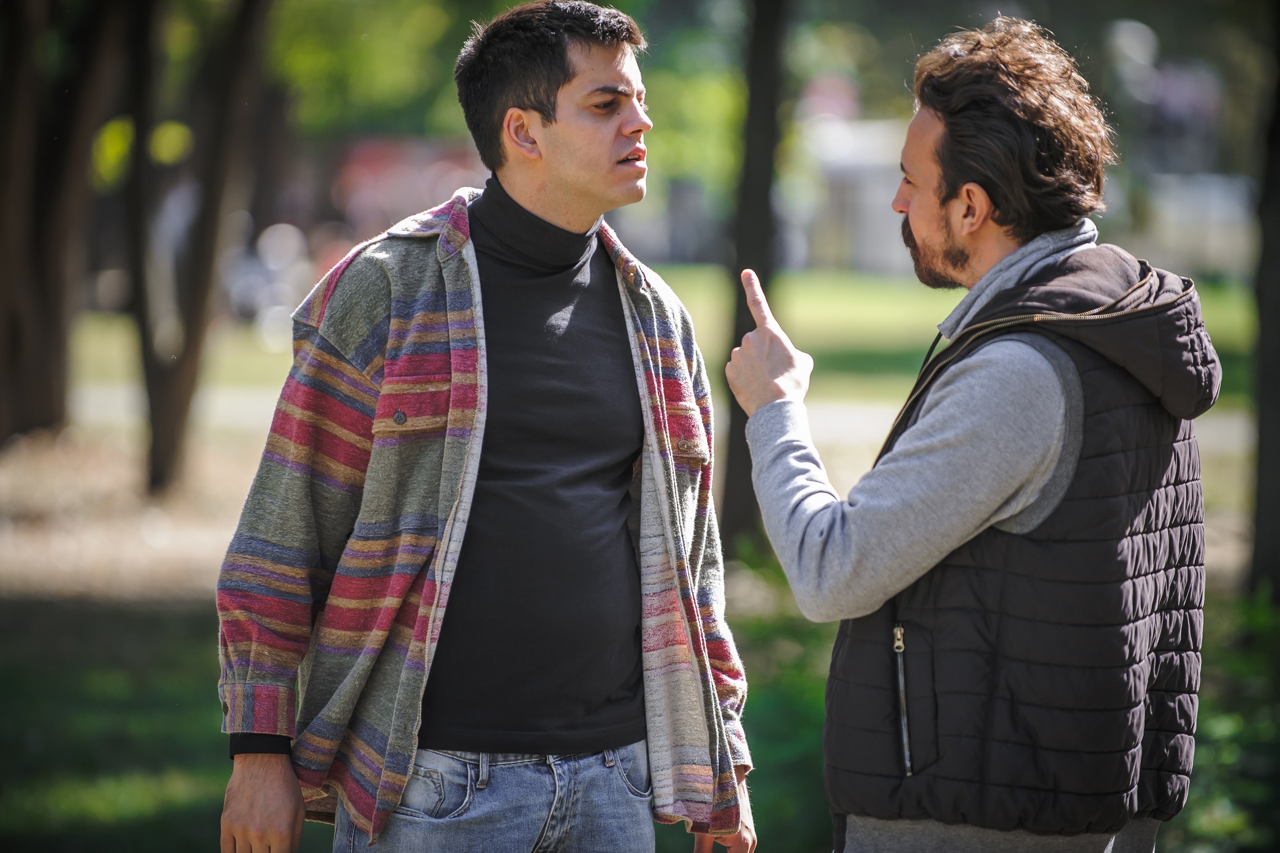 Close-up finger pointing of two very angry, nervous and upset men in an aggressive and fierce quarrel conflict on the verge of a physical confrontation and a fight. Concept of male conflict